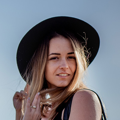 Girl with floppy hat enjoying the spring weather.